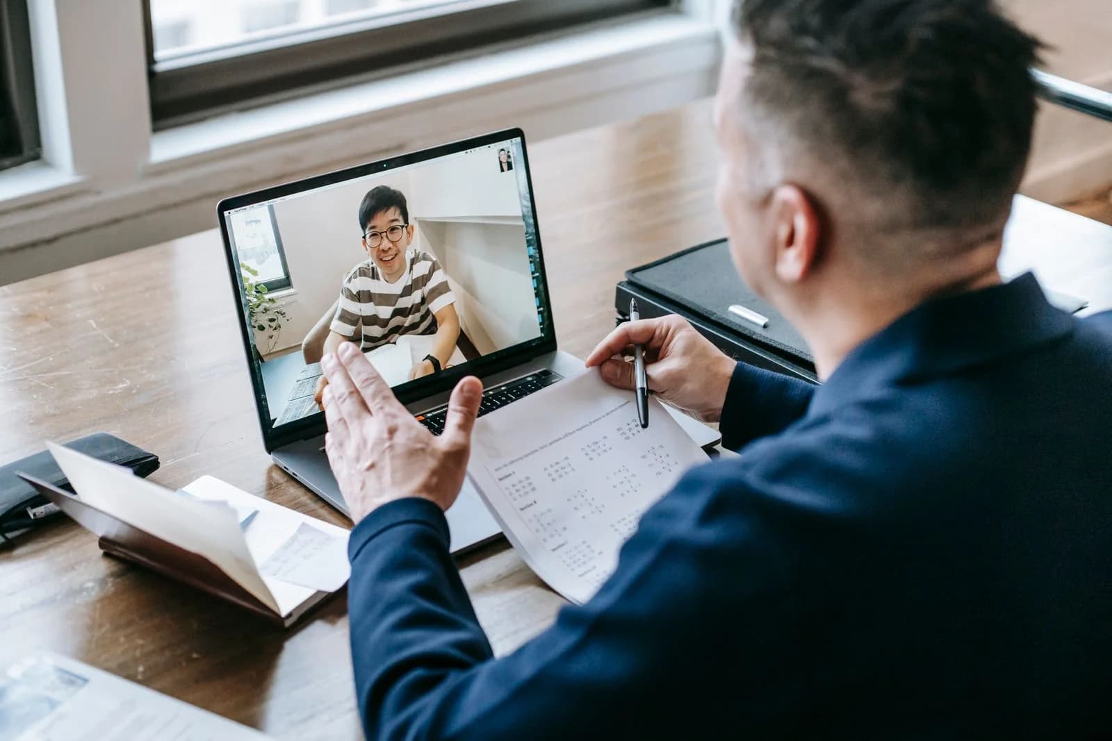 Mentor guiding a student one-to-one over a video call